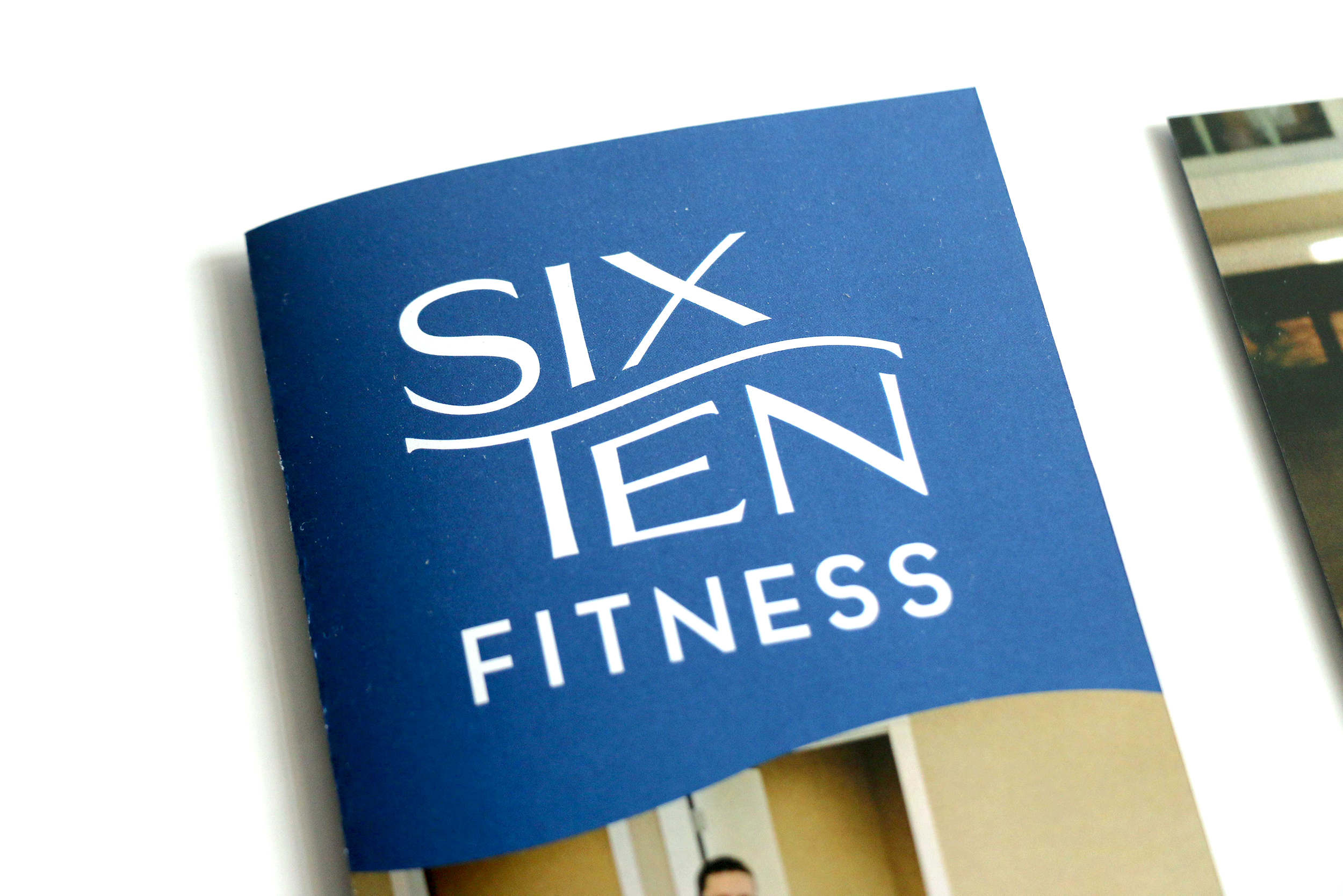 Image of a blue brochure with the title Six Ten Fitness